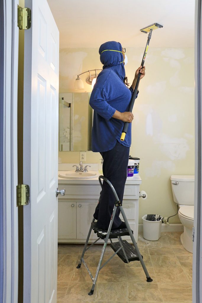 DIY blogger sanding ceilings