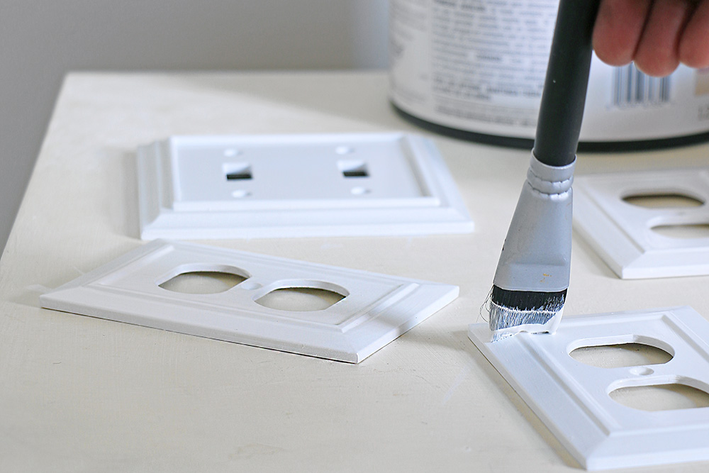 outlet covers and wall switch plates being painted