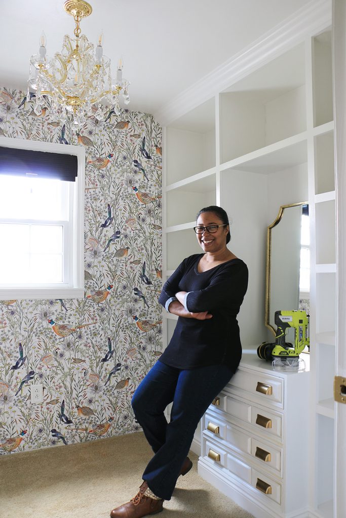 DIY blogger Ursula standing by closet units