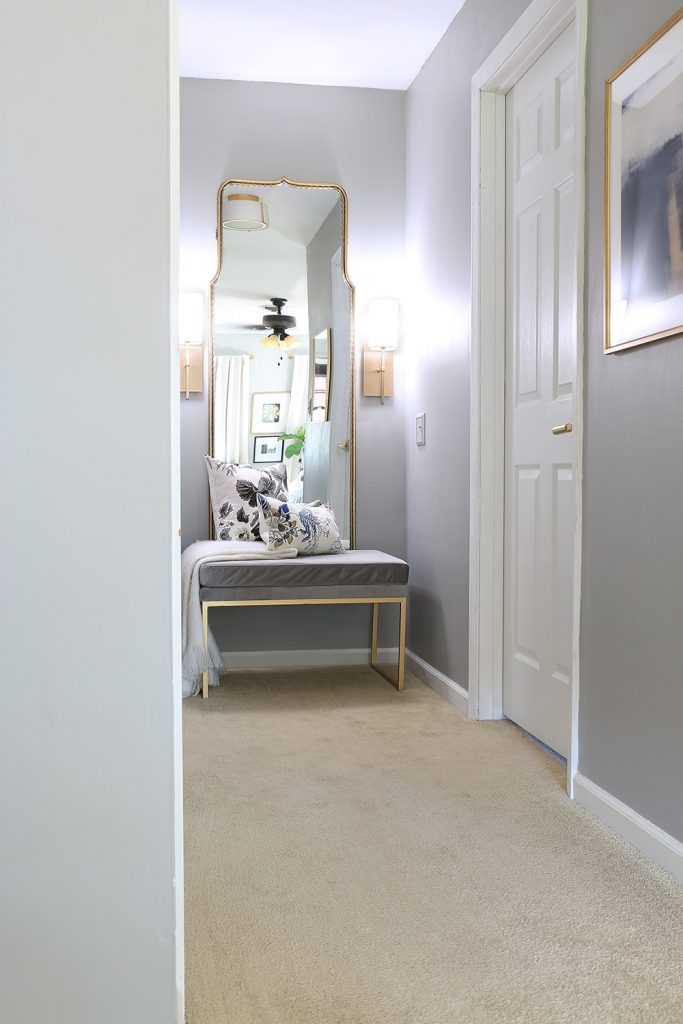 Nook with mirror bench and sconce