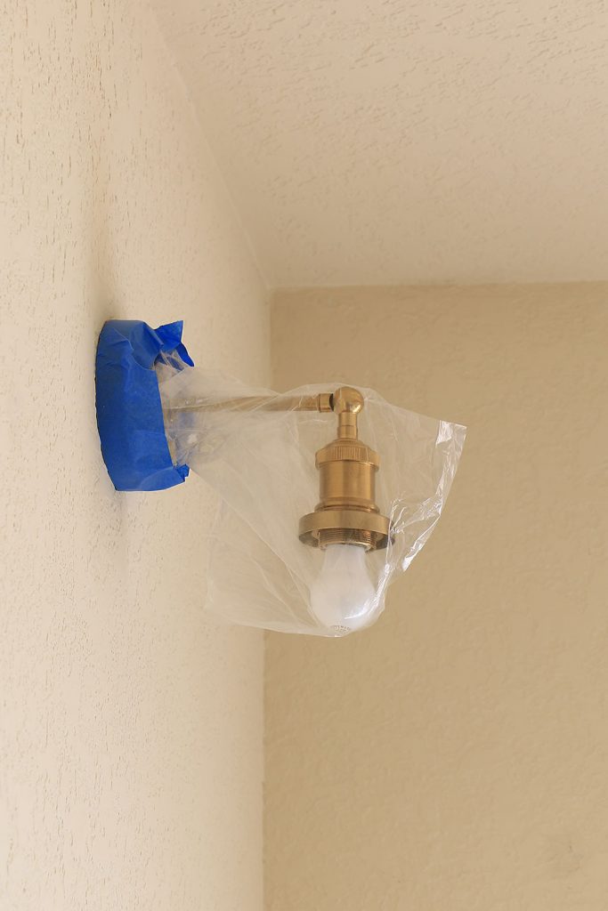 bagged light fixture for paint job