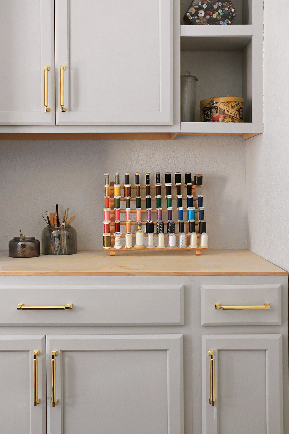 sewing room with spools of thread