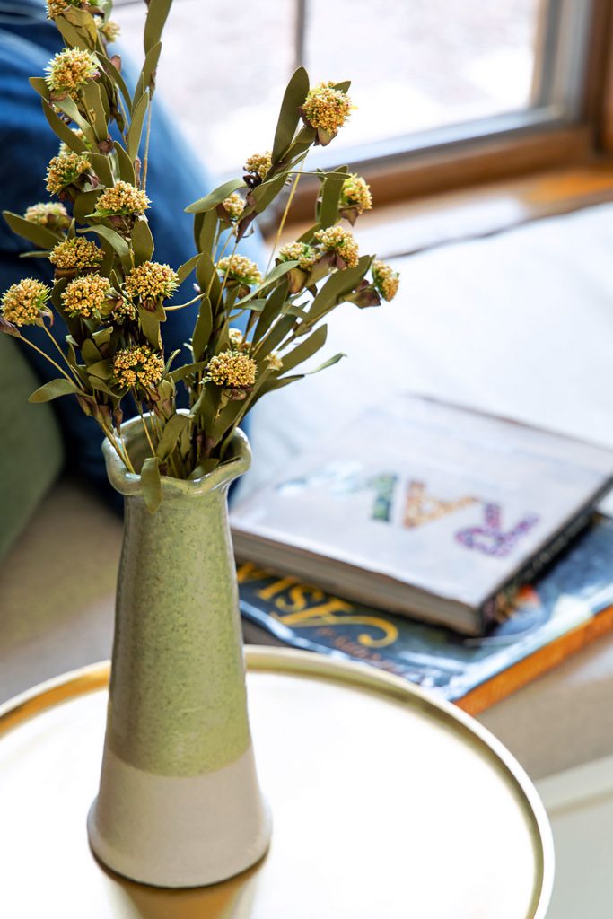 green vase with fall flowers