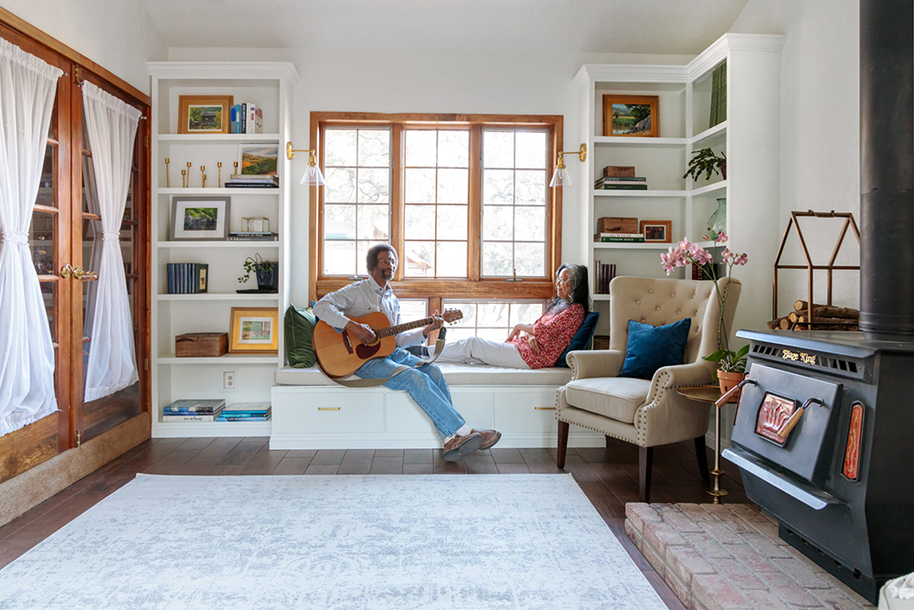 Donald Towns and Karen Towns lounging in their library