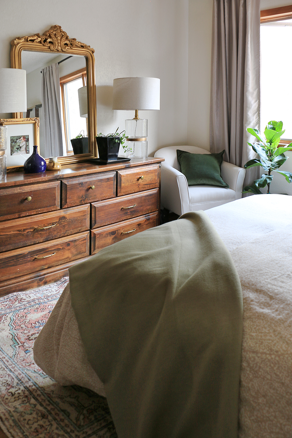 Gold mirror in bedroom