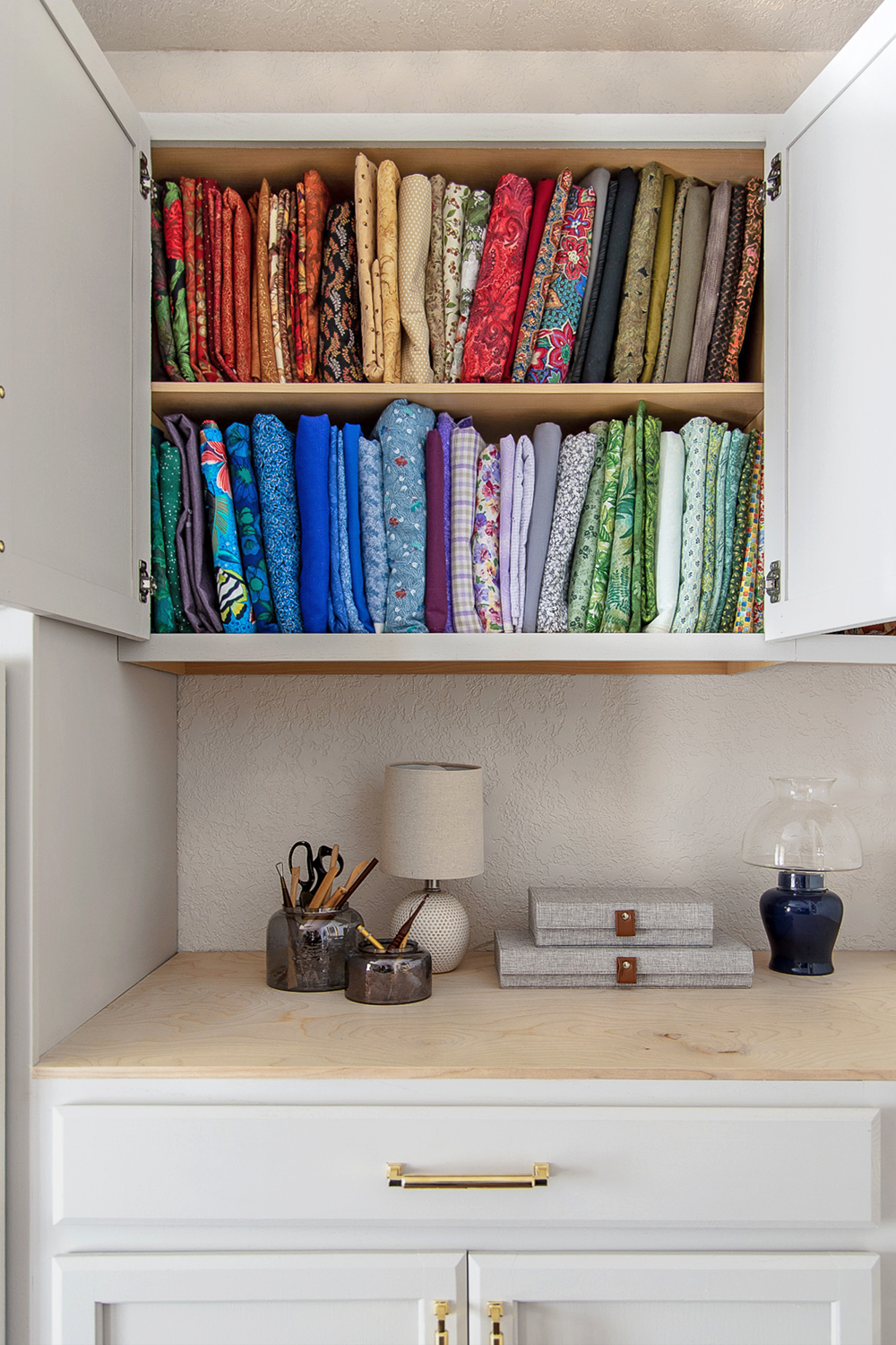 cabinets with bolts of fabric