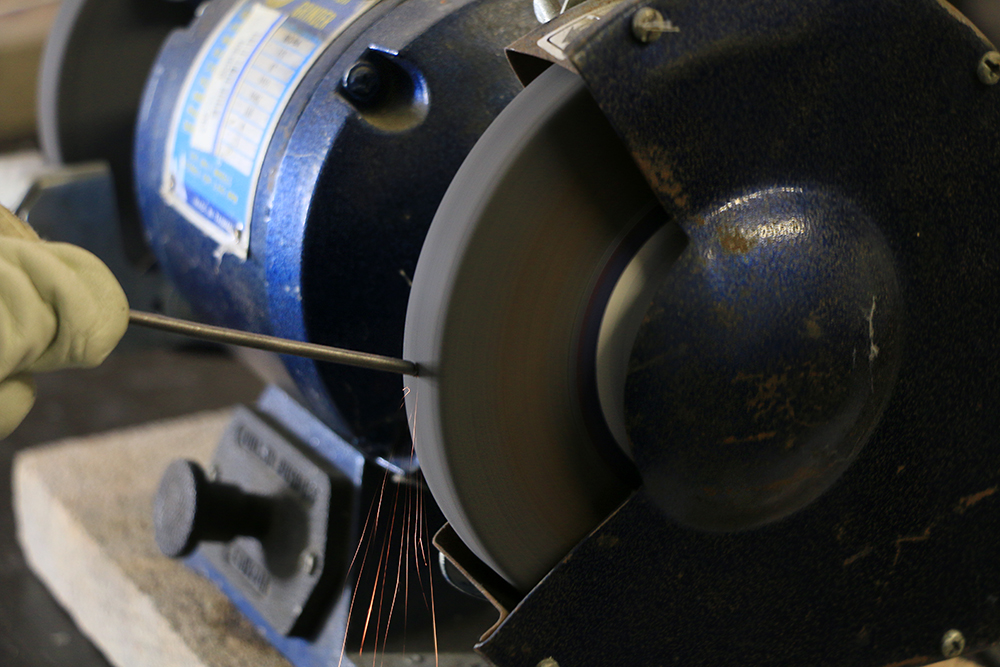 Sanding steel rods