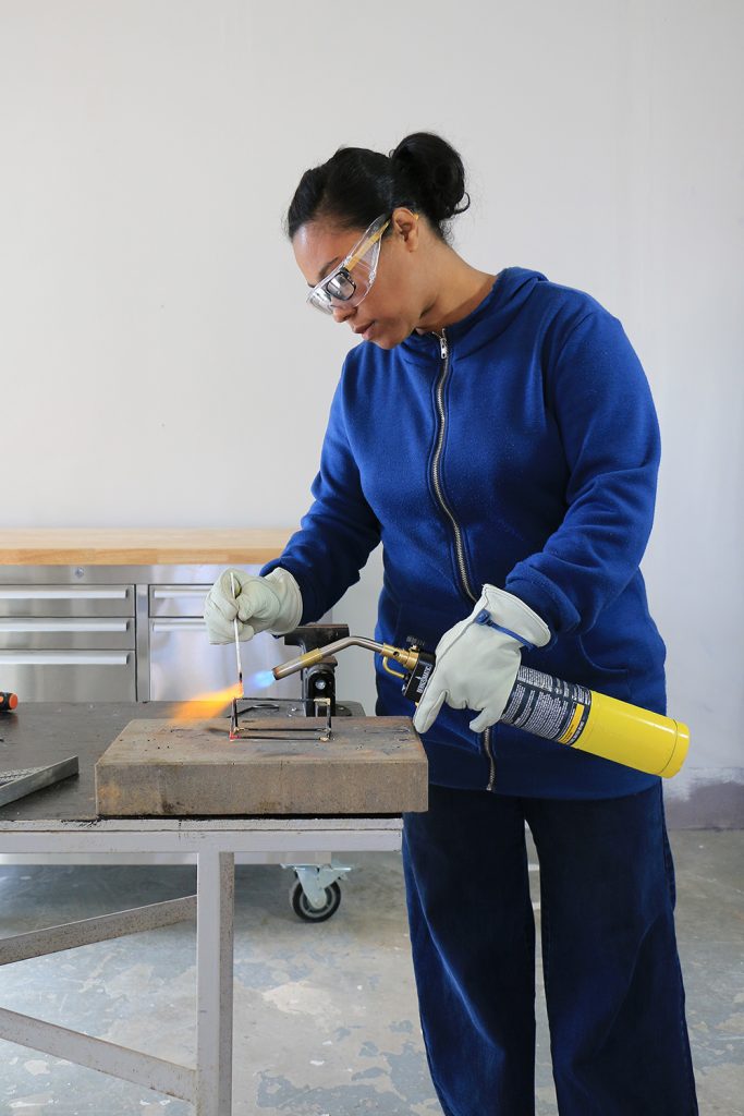 Ursula Carmona using torch