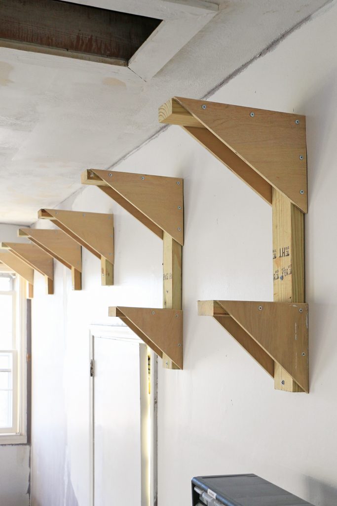 lumber rack on garage wall