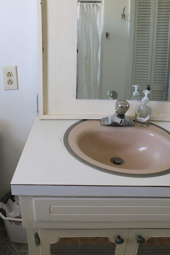 outdated broken bathroom vanity