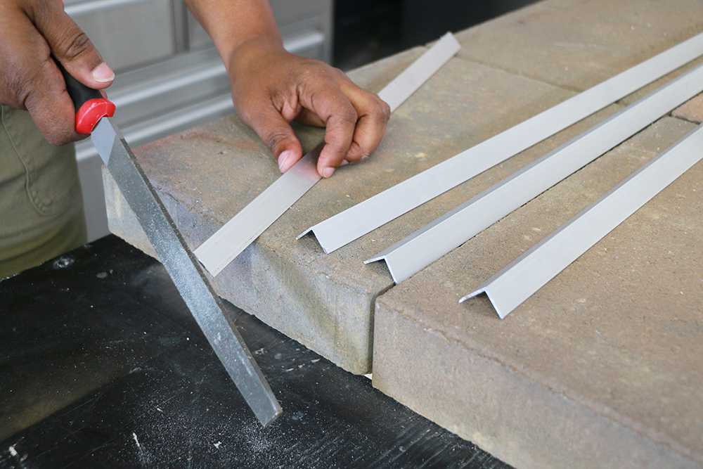 Filing edges on aluminum bars