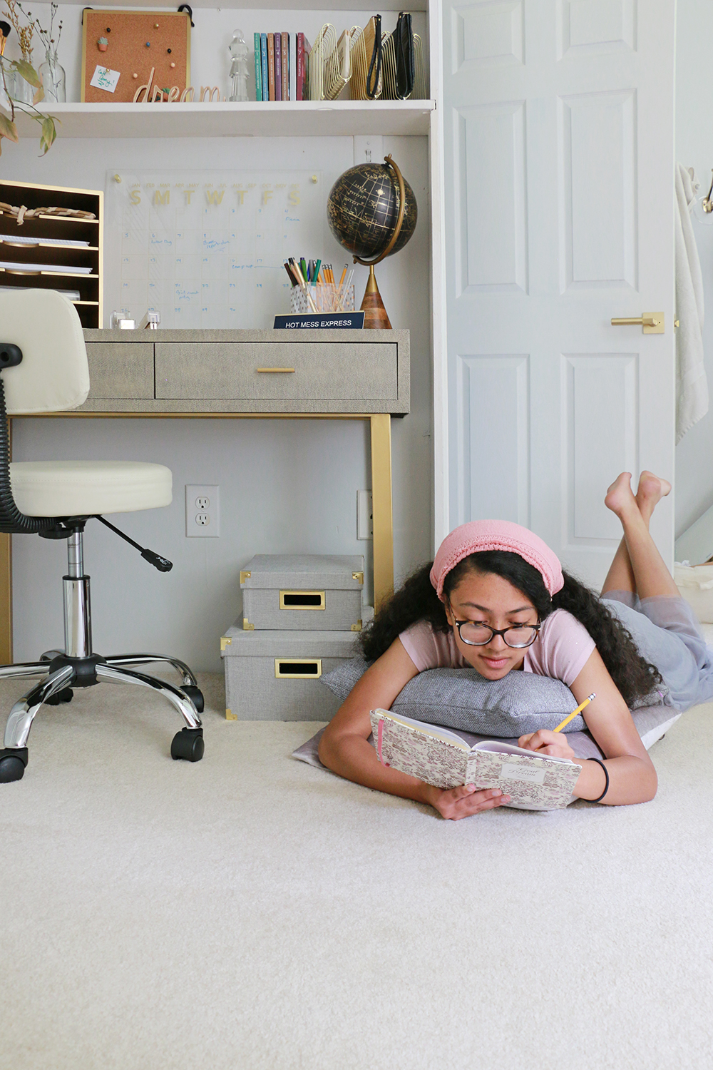 girl sprawled on carpeted floor